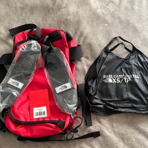 The North Face Red Backpack with Packable Black Tote
